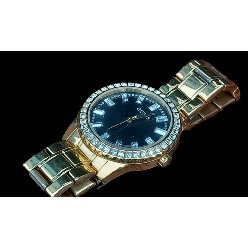 282 - A GUESS GOLD TONE BLACK DIAL SPARKLY DIAL WATCH