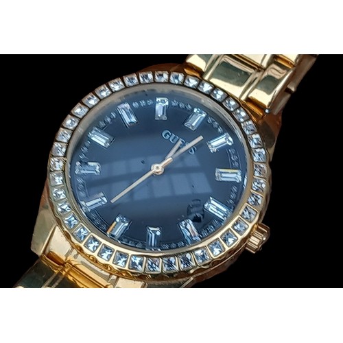 282 - A GUESS GOLD TONE BLACK DIAL SPARKLY DIAL WATCH