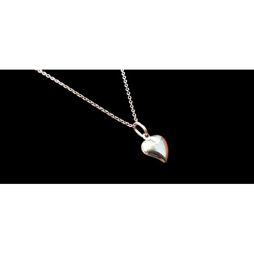 538 - A 9CT HEART PENDANT ON A 9CT CHAIN