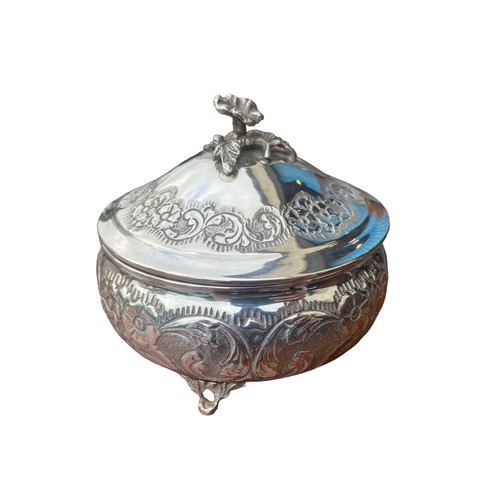 543 - A HEAVILY EMBOSSED WITH FLORAL DESIGN 900 SILVER DISH WITH LID ON TRIPOD FOOT 365.3G