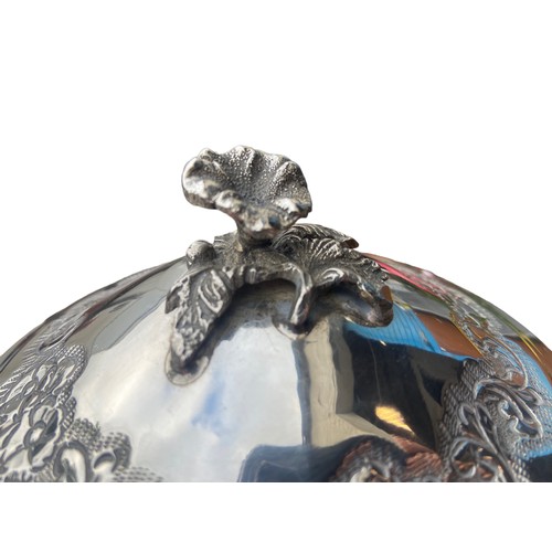 543 - A HEAVILY EMBOSSED WITH FLORAL DESIGN 900 SILVER DISH WITH LID ON TRIPOD FOOT 365.3G