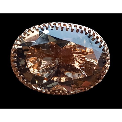 581 - A 9cct GOLD FOB 3cm LENGTH WITH QUARTZ STONE IN SCROLL MOUNT