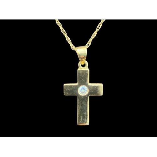 552 - AN 18CT GOLD DIAMOND SET CROSS ON AN 18CT GOLD CHAIN 4G