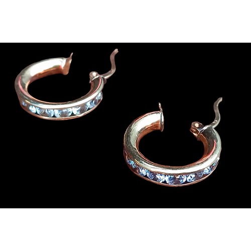 558 - 2 PAIRS OF 9CT GOLD EARRINGS- 1 HOOP SET WITH CLEAR STONES & 1 CREOLE (SLIGHT DENT) 5.5G