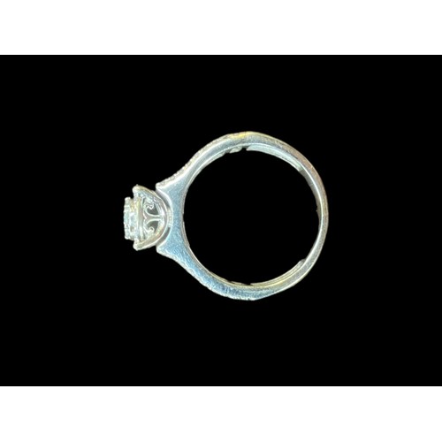 559 - ROUND SET DIAMOND RING WITH BRILLIANT CUT DIAMONDS & BRILLIANT CUT DIAMOND TO EITHER SIDE IN 18CT WH... 