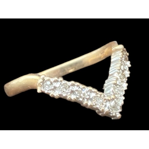 566 - A 9CT GOLD DIAMOND WISHBONE RING