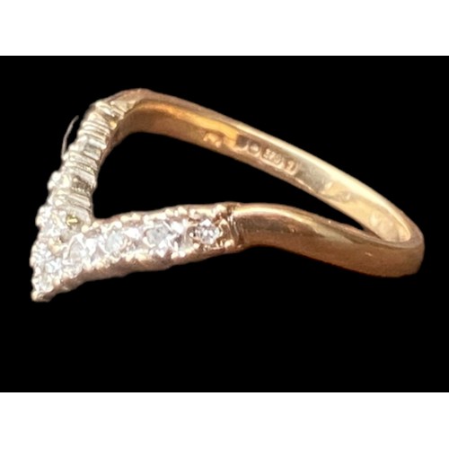 566 - A 9CT GOLD DIAMOND WISHBONE RING