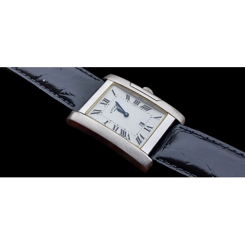 567 - A ROTARY WATCH RETANGULAR WHITE DIAL & DATE WINDOW WORKING ORDER QUARTZ ON BLACK STRAP