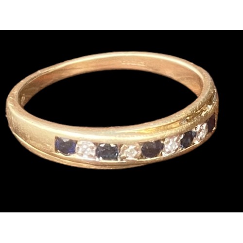 571 - A 9CT GOLD RING SET WITH 5 SAPPHIRES & 4 DIAMONDS WITH A YELLOW GOLD CHANNEL SET MOUNT SIZE P 1/2 2.... 