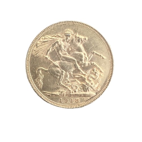 573 - A DOUBLE SILVER SOVEREIGN HOLDER WITH A 1918 SOVERIEGN