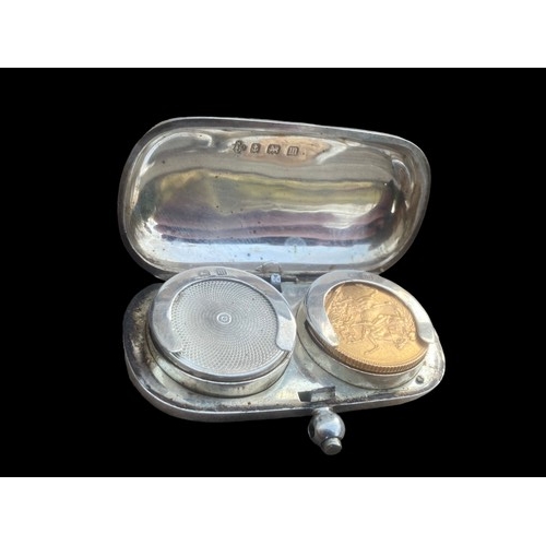573 - A DOUBLE SILVER SOVEREIGN HOLDER WITH A 1918 SOVERIEGN