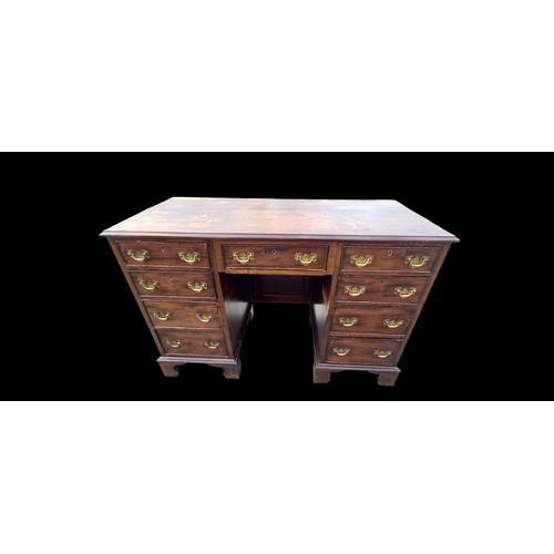 631A - A GEORGIAN  7 DRAWERED DESK