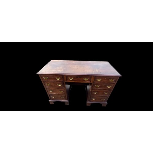 631A - A GEORGIAN  7 DRAWERED DESK