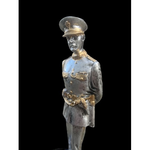 62 - A SILVERED & GILT FINISHED R.U.C FIGURINE ON PLINTH 10