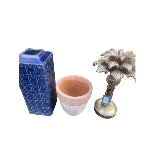 91 - A NEW 3 PIECE LOT TO INCLUDE TERRACOTTA POT,BLUE GLAZED VASE AND PALM TREE CANDLE HOLDER