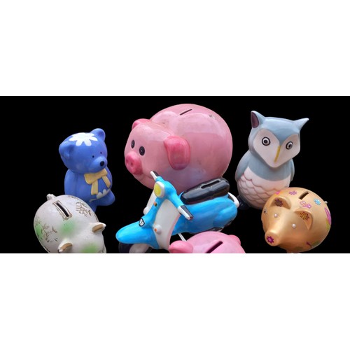 126 - A COLLECTION OF PIGGY BANKS