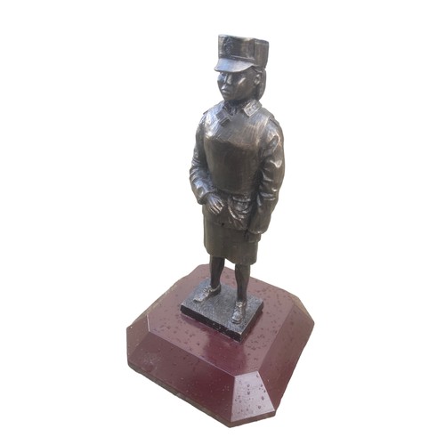 136 - A BRONZED FEMALE POLICE OFFICER 10