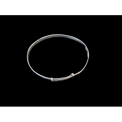 196 - A SILVER EXPANDING BANGLE