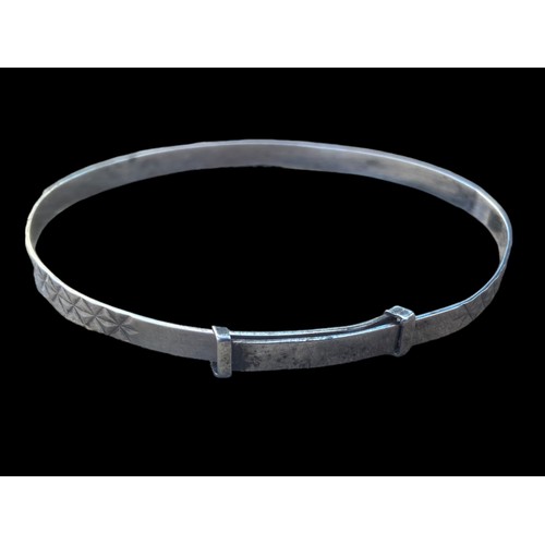 196 - A SILVER EXPANDING BANGLE