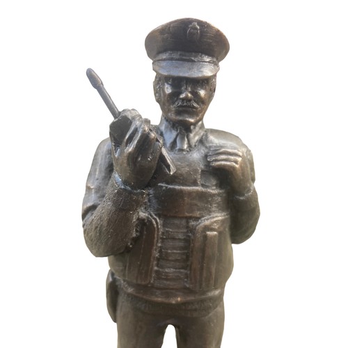 166 - A BRONZED FINISHED R.U.C OFFICER 11