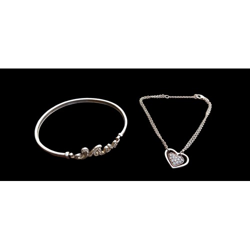 211 - A SILVER MUM BANGLE AND A SILVER CHAIN WITH PENDANT