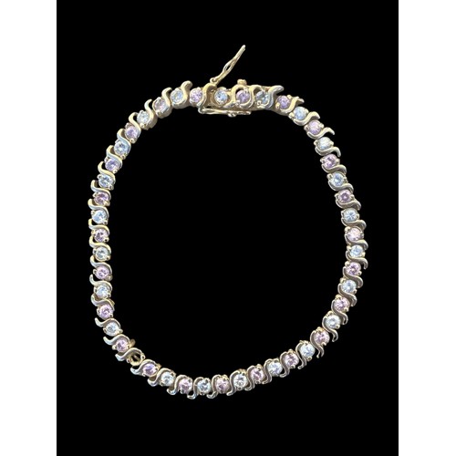 240 - A SILVER GILT GEMSET LINE BRACELET (1 STONE MISSING)