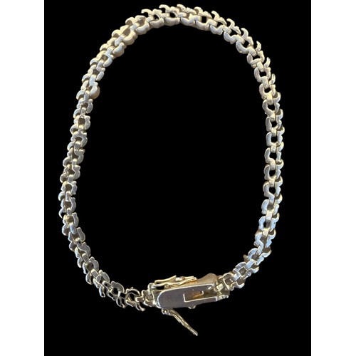 240 - A SILVER GILT GEMSET LINE BRACELET (1 STONE MISSING)