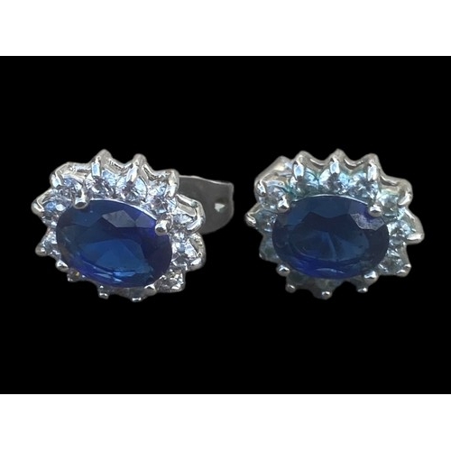 268 - A PAIR OF BLUE AND CRYSTAL SET CLUSTER EARRINGS