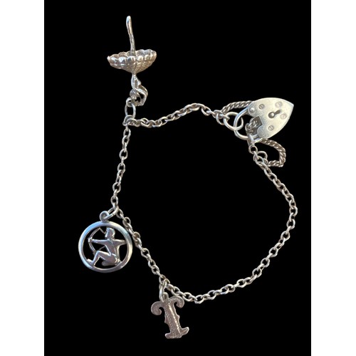 272 - A SILVER CHARM BRACELET WITH CHARMS