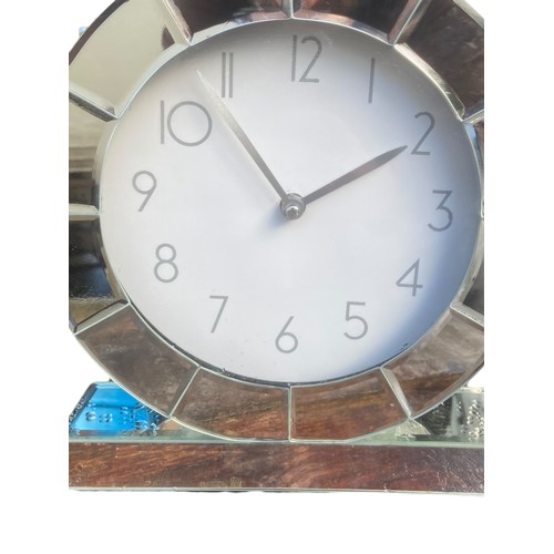 296 - A ODERN MIRROR CLOCK