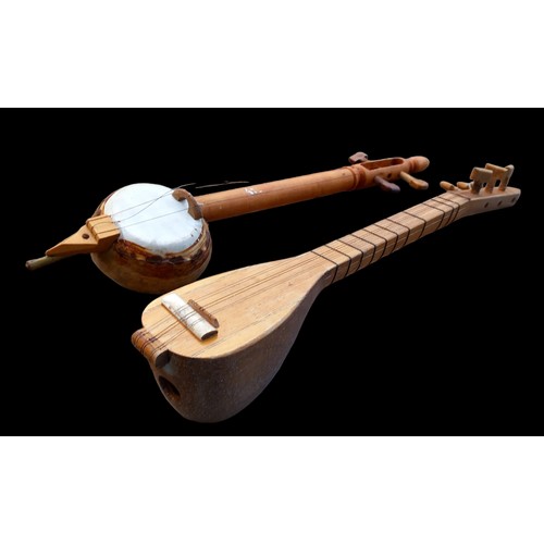 299 - 2 WOODEN MUSICAL INSTRUMENTS