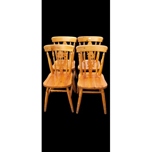 69 - A SET OF 4 PINE FARMHOUSE STYLE CHAIRS