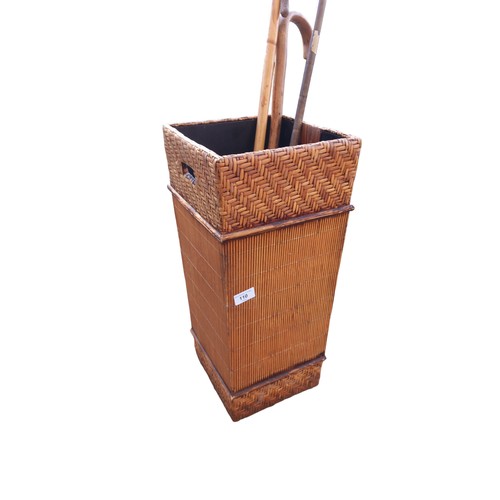 110 - A WICKER FINISHED STICK STAND & 4 STICKS