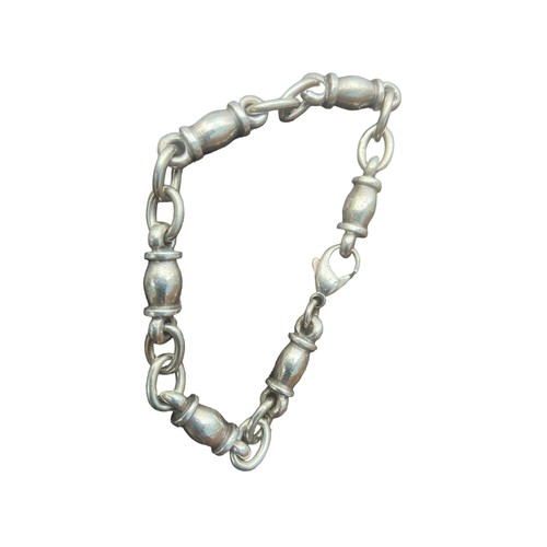 369 - A DESIGNER STYLE WHITE METAL BRACELET