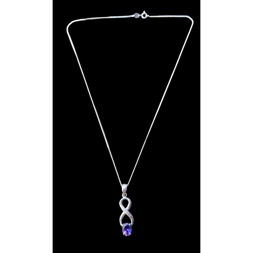 420 - A SILVER CHAIN WITH A SILVER SET AMETHSYT PENDANT