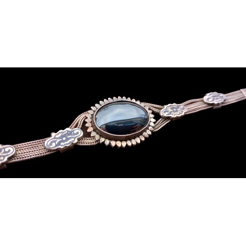 423 - A HEAVY 900 SILVER BRACELET SET WITH A BLACK STONE