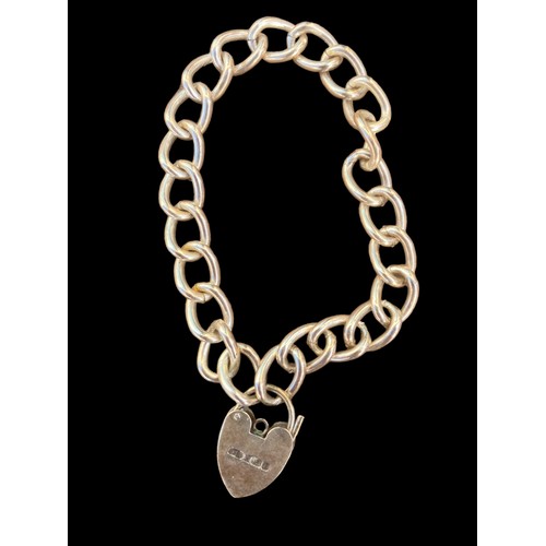 430 - A CURB LINK BRACELET WITH HEART PADLOCK CATCH