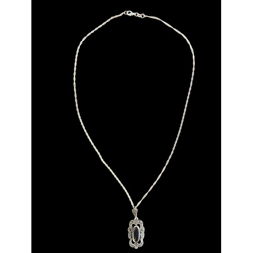 443 - A SILVER ONYX AND MARCASITE PENDANT ON SILVER CHAIN