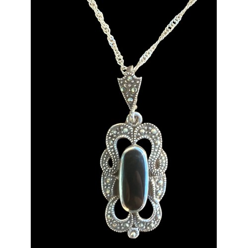 443 - A SILVER ONYX AND MARCASITE PENDANT ON SILVER CHAIN