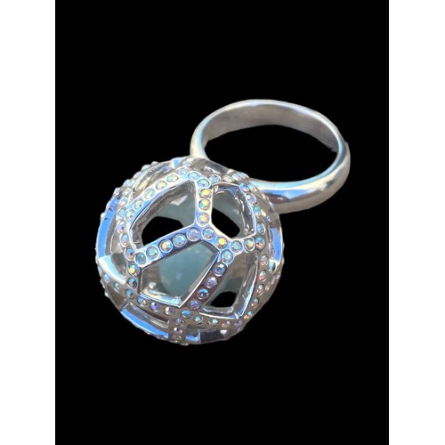 445 - A SILVER  GEMSET PUZZLE RING WITH JADE BALL SIZE L