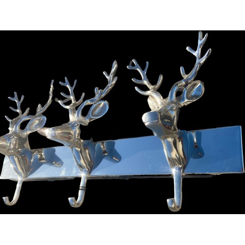 455 - A NEW POLISHED CHROME COAT RACK WITH 3 STAG HEADS AS HANGERS 22