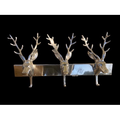 455 - A NEW POLISHED CHROME COAT RACK WITH 3 STAG HEADS AS HANGERS 22