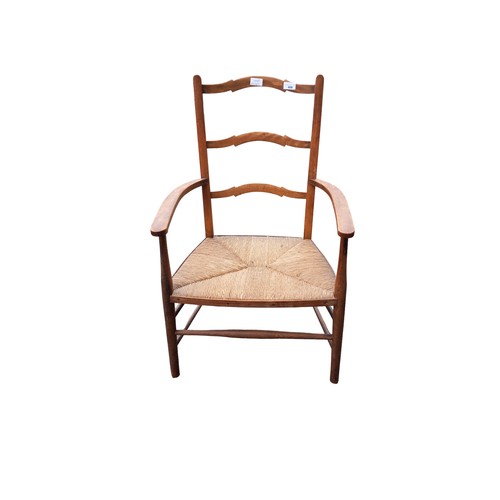 340 - ANTIQUE PINE ARMCHAIR WITH RUSH SEAT