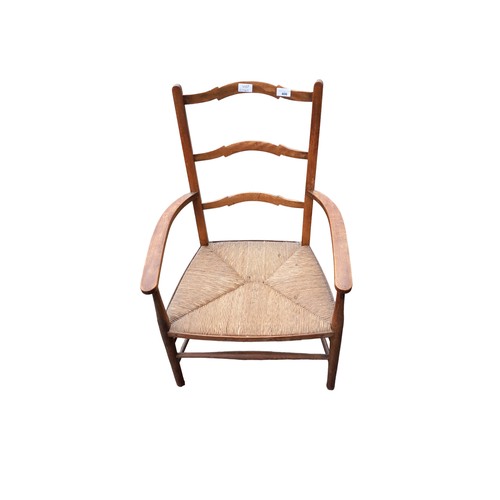 340 - ANTIQUE PINE ARMCHAIR WITH RUSH SEAT