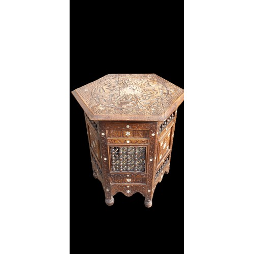 385 - A M.O.P INLAID ISLAMIC/MOORISH CARVED OCTAGONAL TABLE (SOME DAMAGE TO ONE LEG)