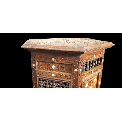 385 - A M.O.P INLAID ISLAMIC/MOORISH CARVED OCTAGONAL TABLE (SOME DAMAGE TO ONE LEG)