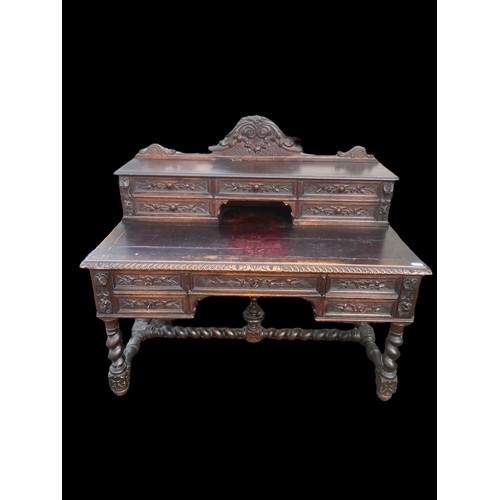 594 - A VICTORIAN CARVED OAK DESK ON HEAVY TURNED LEG ORNATE CARVINGS TO DRAWERS AND GALLERY TOP ALSO NICE... 