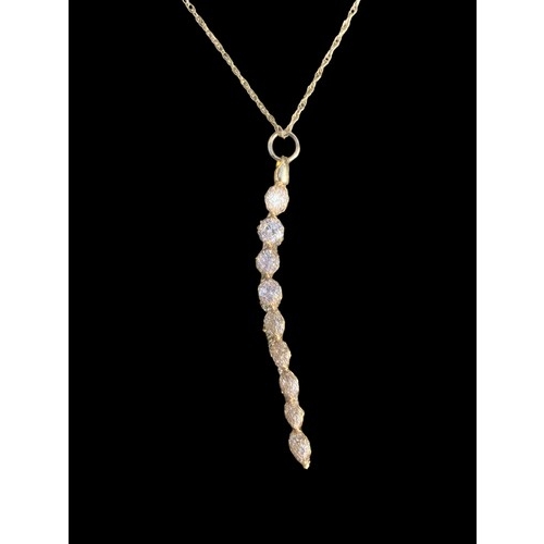 634 - A 9CT GOLD DROP DESINGER CRYSTAL PENDANT ON A 9CT CHAIN