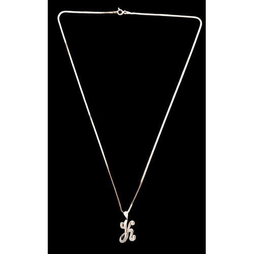 483 - A 14CT GOLD K PENDANT ON A 14CT GOLD CHAIN