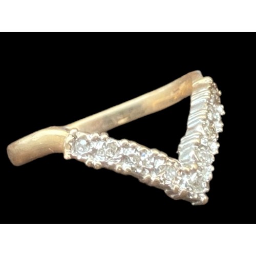 490 - A 9CT GOLD DIAMOND WISHBONE RING